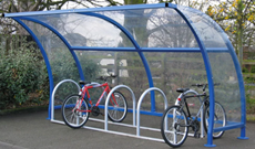 Enclosed single canopy bicycle storage shelter.