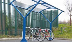 Outdoor single canopy bicycle storage shelter.