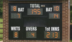 Custom installed electronic cricket scoreboard.