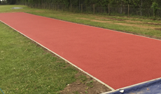 Ipswich school outdoor polymeric multiple athletic run and landing area pit.