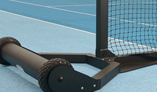 Integral weighted mobile tennis posts with roller base.