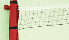 Wall mounted steel volleyball posts.