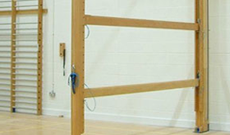 Timber wall mounted folding climbing gymnasium balance beams.