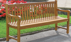 Outdoor public wooden public use seating bench.