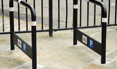 Public steel ground fixed bicycle secure stands.