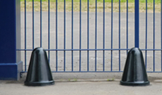 A cast iron dockyard vehicle access bollard.