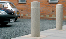 A cast iron dockyard vehicle access bollard.