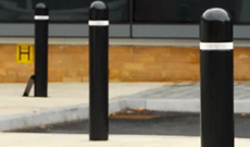 Municipal PVC plastic vehicle access bollard post.