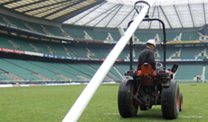 Hinged rugby post removal assembly roller.