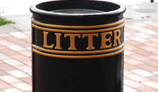 Cast iron open top ground fixed public litter bin.