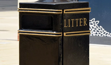 Cast iron large square ground fixed public litter bin.