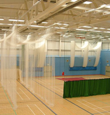 Sports hall roof mounted division netting