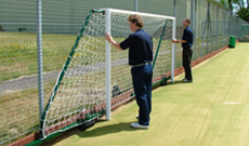 Wall folding & retracting football goalposts.